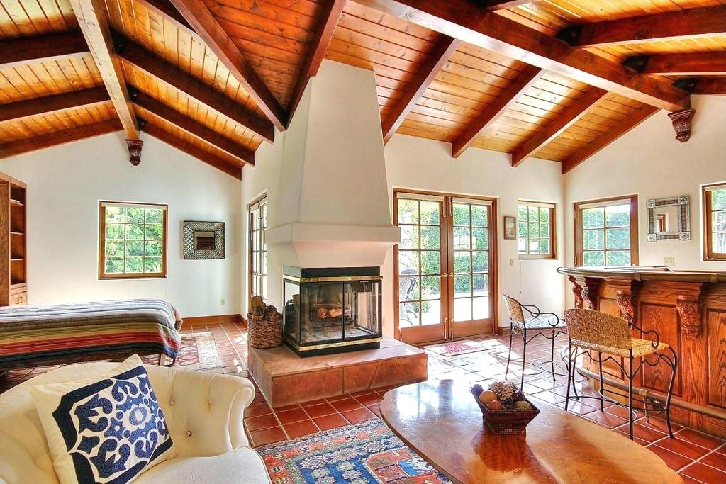 exposed beams images master bedroom with pine ceiling high ceiling terracotta tile floors metal fireplace exposed ceiling beams images