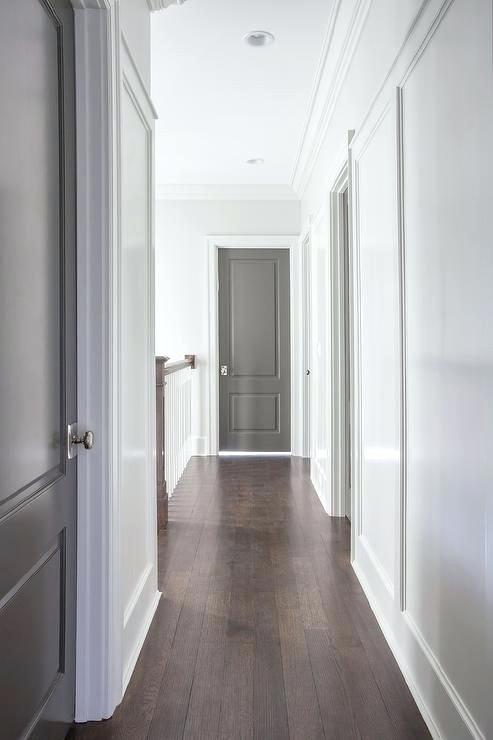 hallway doors ideas chic hallway features white walls fitted with gray paneled doors adorned with polished nickel door knobs