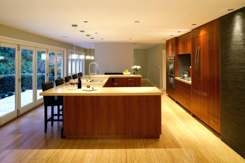 light hardwood floors wall color this clean cut kitchen is brightened by the light wood floor and matching